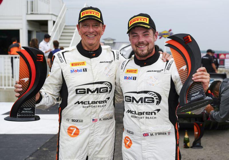 Randy Highland and Michael O'Brien with their Road America McLaren Trophy podium trophies