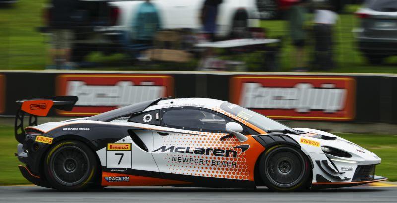 The No. 7 GMG Racing McLaren Artura Trophy Evo at speed at Road America in its new McLaren Newport Beach livery